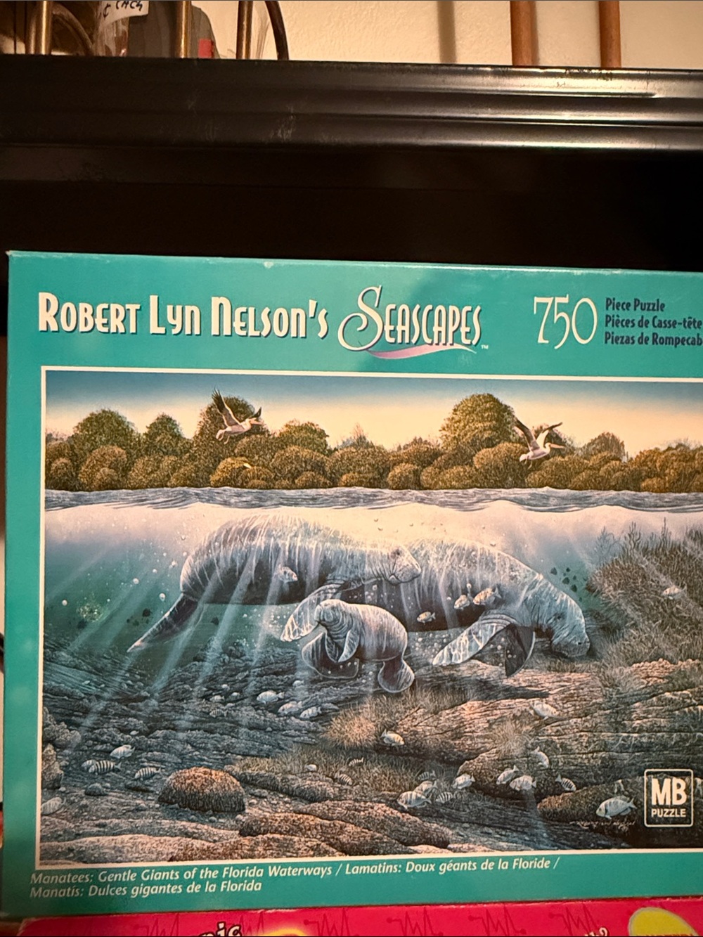 Hasbro Manatees Puzzle by Robert Lyn Nelson. Box sealed but worn. All pieces.